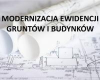 Mapy ewidencyjne i napis Modernizacja Ewidencji Gruntów i Budynków