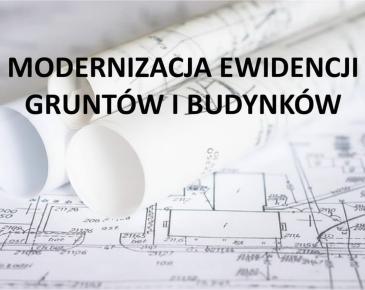 Mapy ewidencyjne i napis Modernizacja Ewidencji Gruntów i Budynków